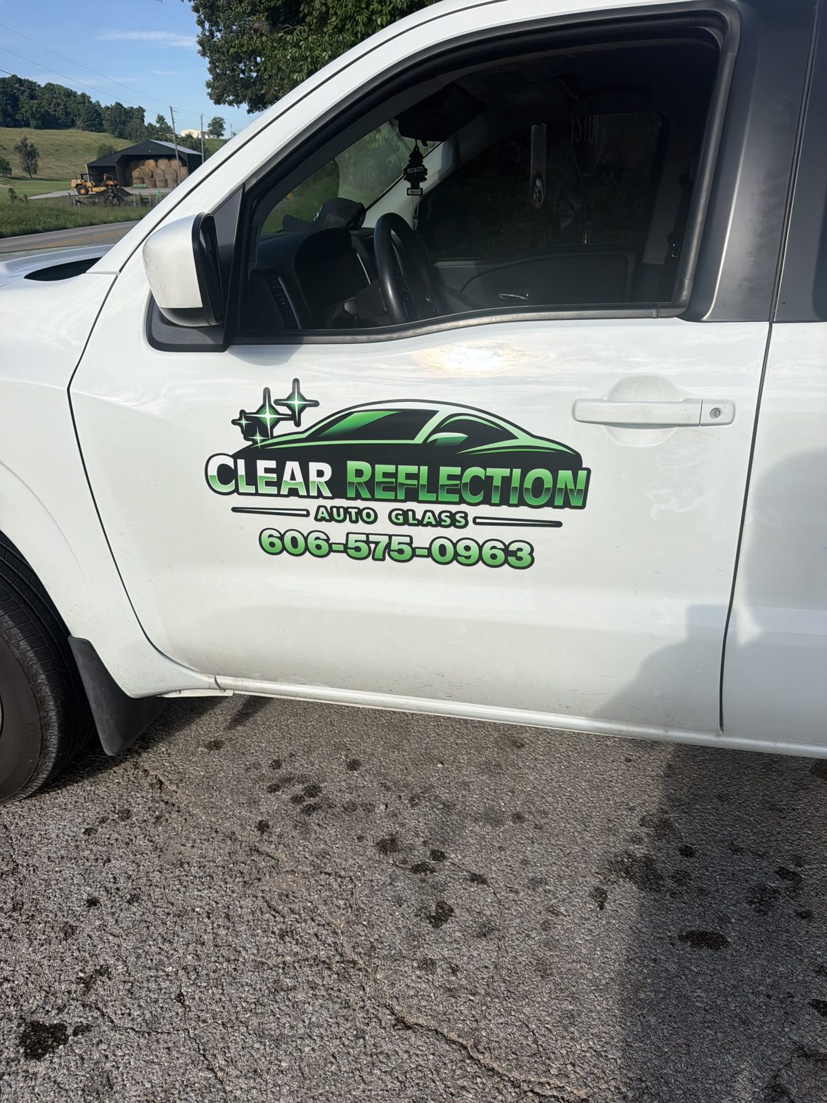 Clear Reflection logo on truck door